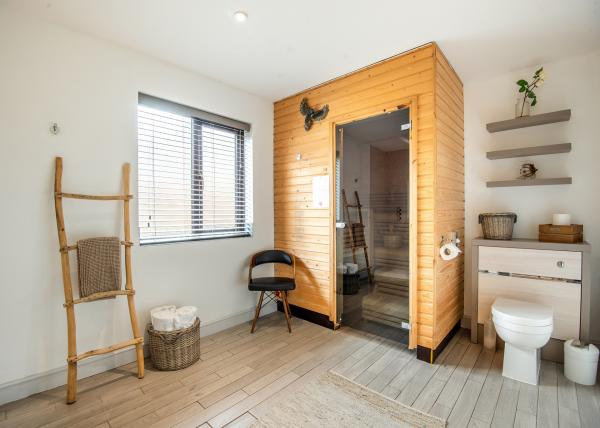 New Hampshire lodge bathroom with sauna